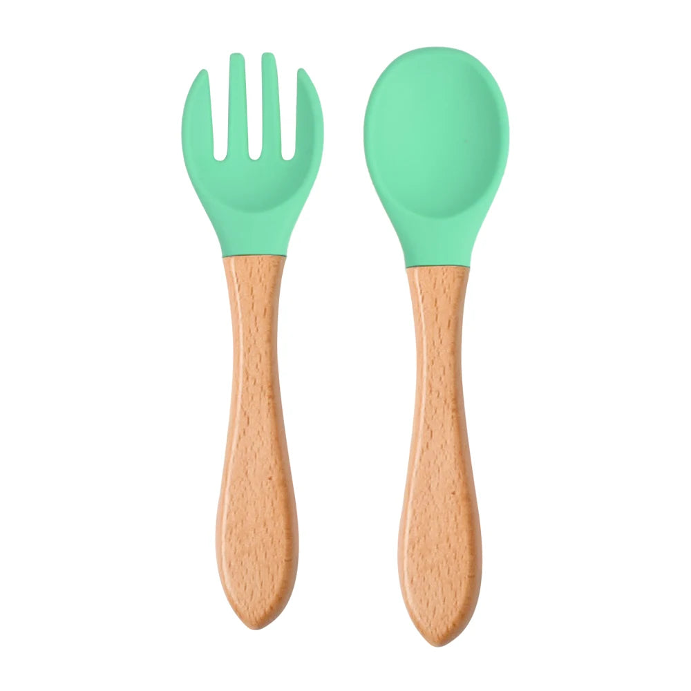 Ensemble de 2 cuillères et fourchettes en silicone pour bébé avec manche en bois - Accessoires d'alimentation pour nourrissons et tout-petits.