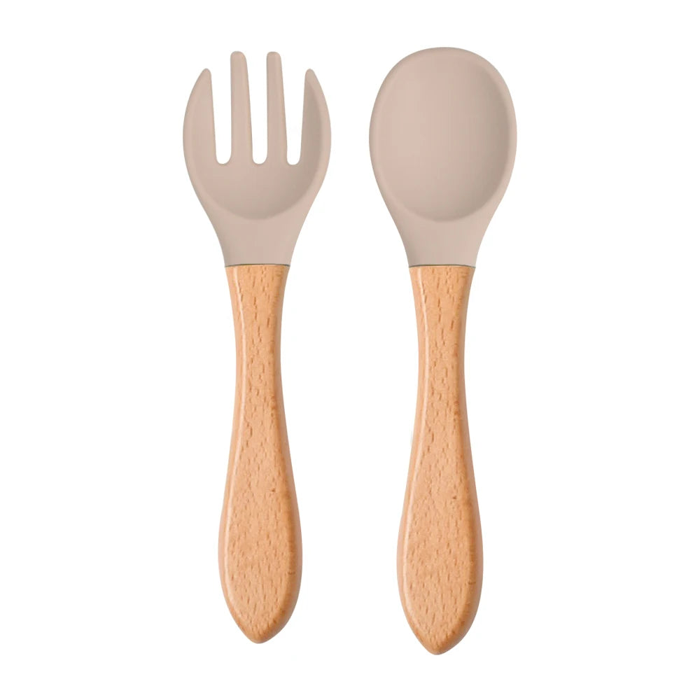 Ensemble de 2 cuillères et fourchettes en silicone pour bébé avec manche en bois - Accessoires d'alimentation pour nourrissons et tout-petits.
