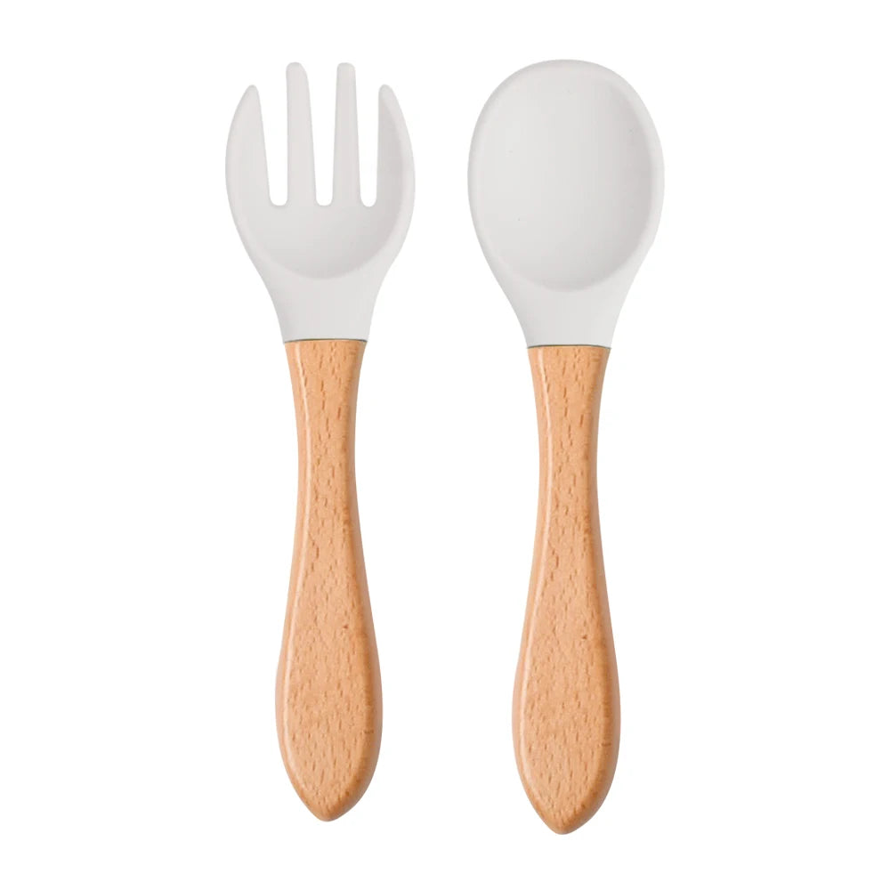 Ensemble de 2 cuillères et fourchettes en silicone pour bébé avec manche en bois - Accessoires d'alimentation pour nourrissons et tout-petits.
