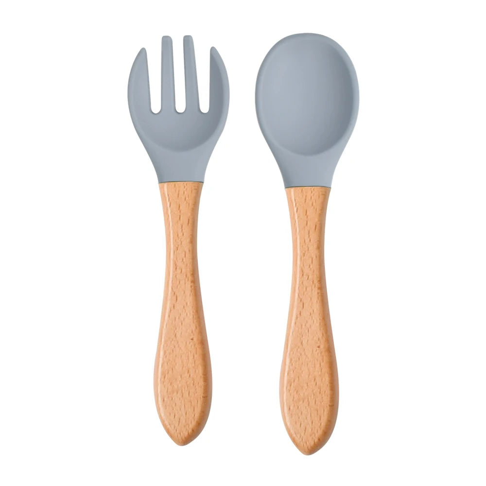 Ensemble de 2 cuillères et fourchettes en silicone pour bébé avec manche en bois - Accessoires d'alimentation pour nourrissons et tout-petits.