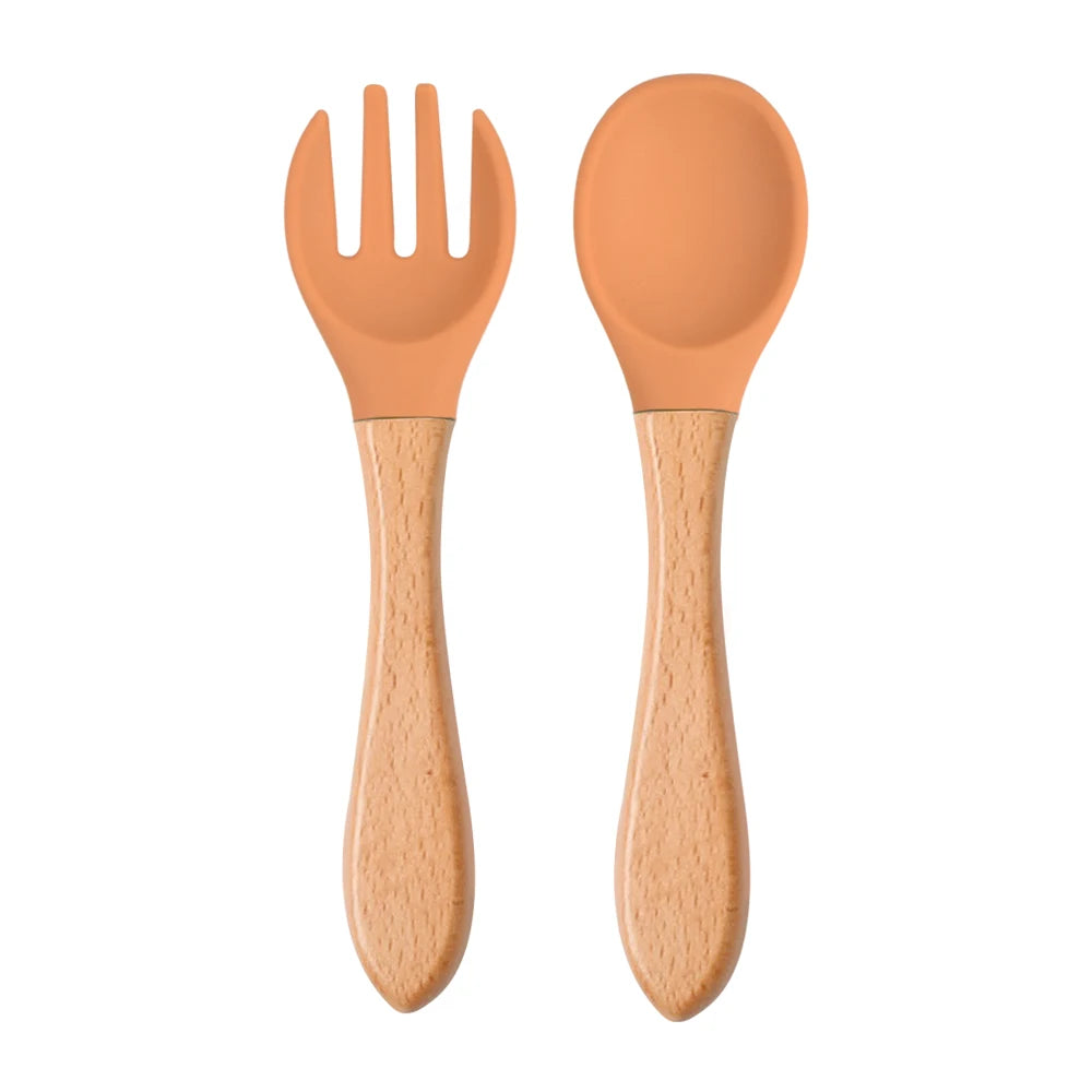 Ensemble de 2 cuillères et fourchettes en silicone pour bébé avec manche en bois - Accessoires d'alimentation pour nourrissons et tout-petits.