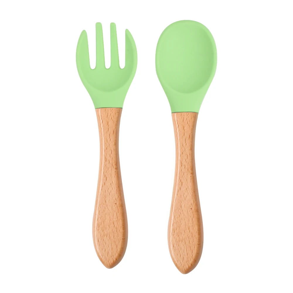 Ensemble de 2 cuillères et fourchettes en silicone pour bébé avec manche en bois - Accessoires d'alimentation pour nourrissons et tout-petits.